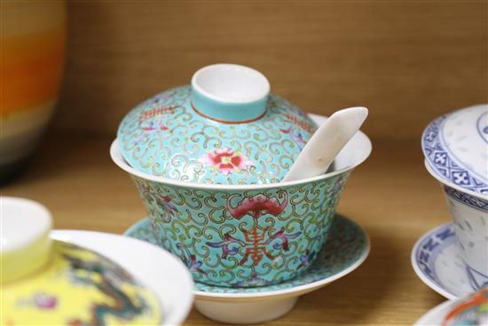 Five Chinese porcelain rice bowls, covers and stands, together with two spoons, second half 20th century, bowls 10.5cm diameter
